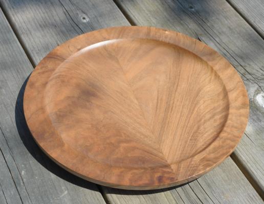 Mirror matched English walnut platter. Upper surface, 25 cm diameter, 2.3 cm high.